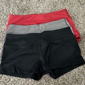 Rouen spandex booty shorts. 3 pairs - black, grey, red. Size medium.